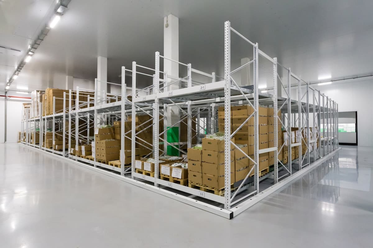 Pallets, racking and order boxes in a distribution warehouse